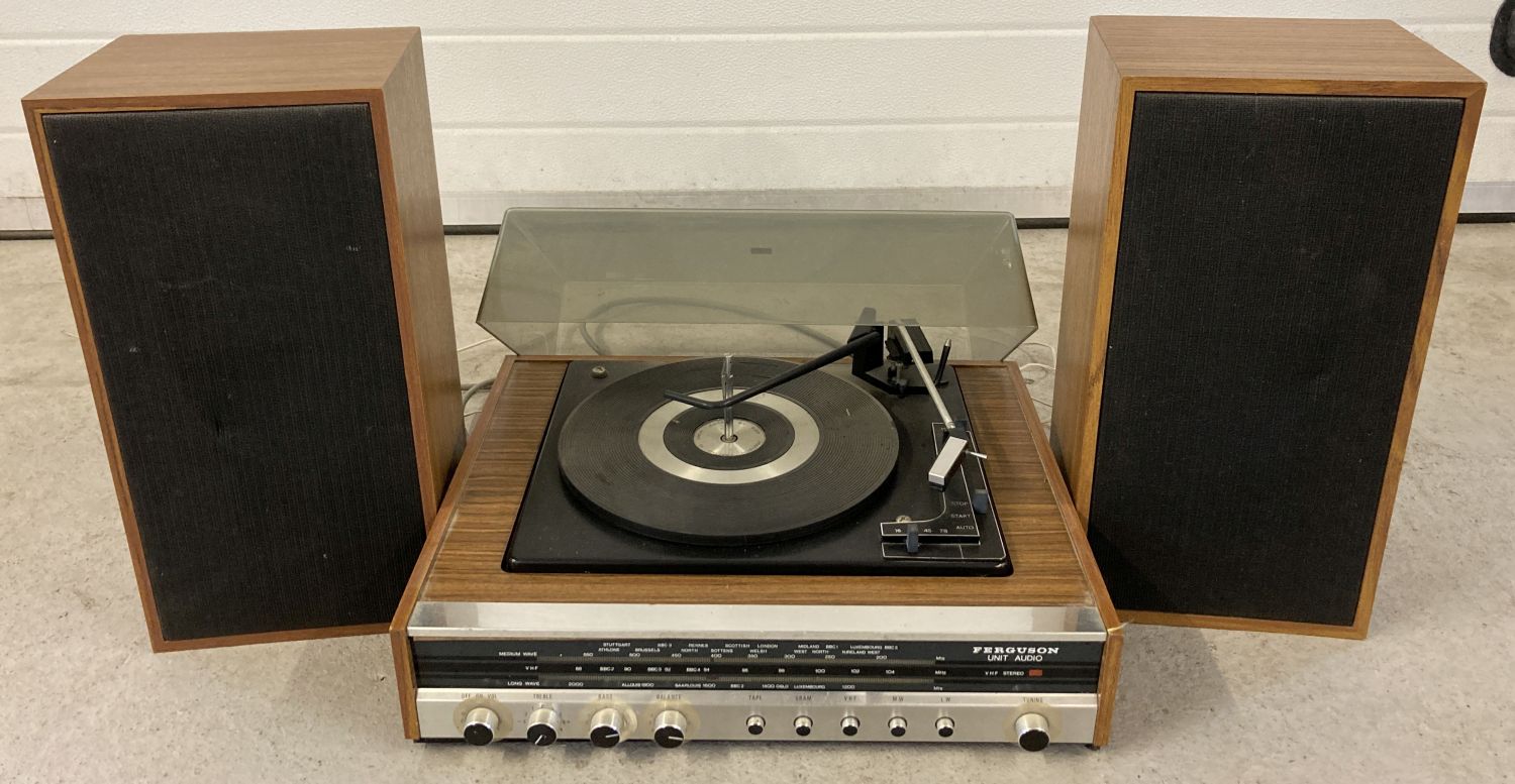 A vintage Ferguson auto change record turntable with integrated radio. Complete with 2 speakers.