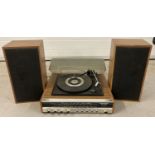 A vintage Ferguson auto change record turntable with integrated radio. Complete with 2 speakers.