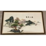 A very large Chinese embroidered silk panel depicting a mountainous lake scene.