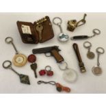 A collection of 13 vintage keyrings, to include advertising and novelty.
