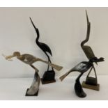 4 bird figures carved from natural horn, 3 with small wooden bases.