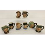 A collection of 8 miniature Royal Doulton ceramic toby jugs.