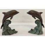A pair of bronze dolphins, riding a wave, figures/bookends.