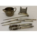 A small quantity of assorted vintage silver plated & pewter items to include nutcrackers.