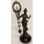 A bronze based figural, swinging pendulum mystery clock.