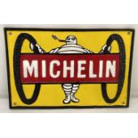 A Michelin Tyres painted cast metal wall hanging plaque.