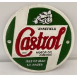 A circular shaped cast metal Castrol Motor Oil Isle of Man T.T. Races wall plaque.