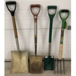 A small collection of gardening tools to include shovels, spade and fork.