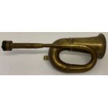 A vintage brass car horn by Deluxe, rubber bulb perished and missing.