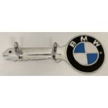 An aluminium wall hanging key hook with painted BMW logo.