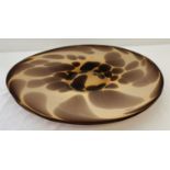 A large oval shaped Art glass shallow bowl in brown tones.