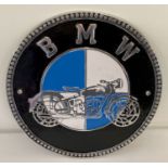 A circular shaped, painted aluminium, BMW Motorcycles wall plaque.