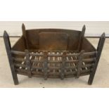 A black wrought iron fire basket.