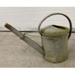 A vintage Regina one gallon galvanised watering can.