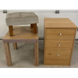 A modern 3 drawer bedside cabinet together with a small modern coffee table and velour topped stool.