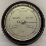 A vintage British made circular bakelite cased barometer.