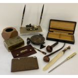 A collection of smoking related and desk items.