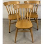 3 matching pine farmhouse style, slat back kitchen chairs with turned detail to legs.