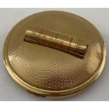 A vintage goldtone compact with lipstick holder by Melissa with carry pouch.