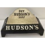 A black and white painted cast iron Hudson's Soap dog drinker.