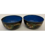A pair of vintage oriental cloisonne tea bowls with dragon decoration.