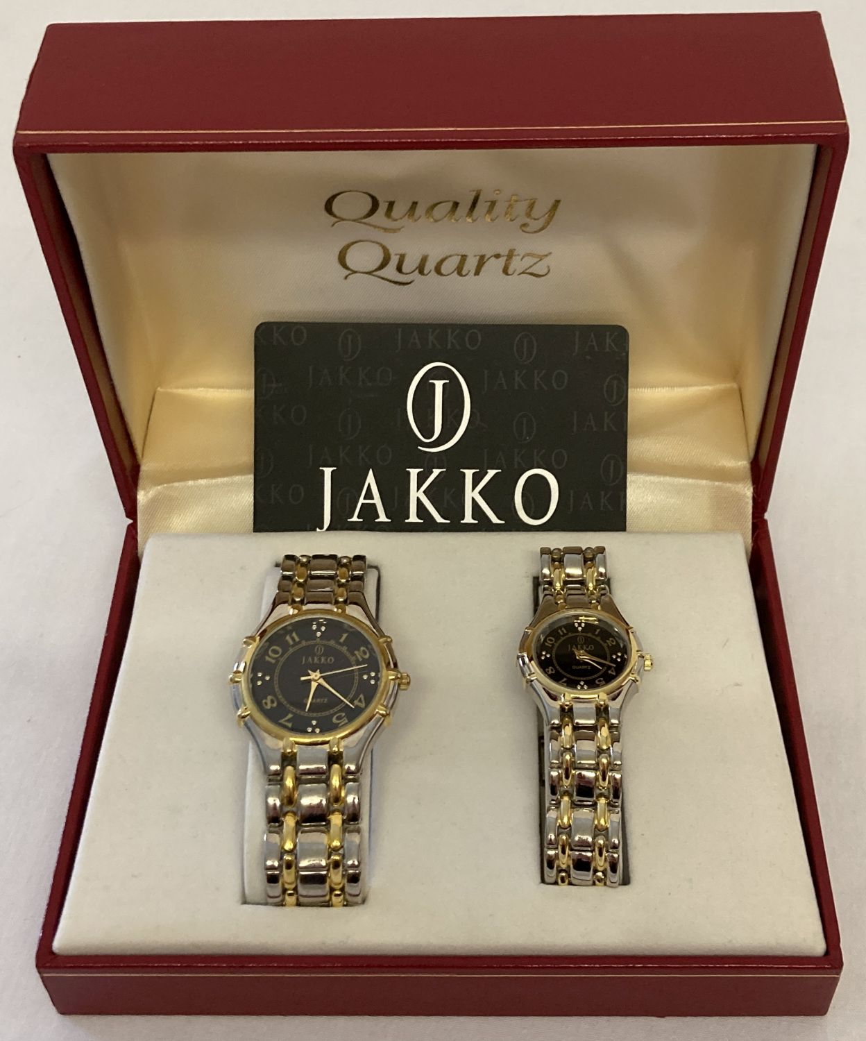 A boxed ladies and gents matching quartz wristwatch set.