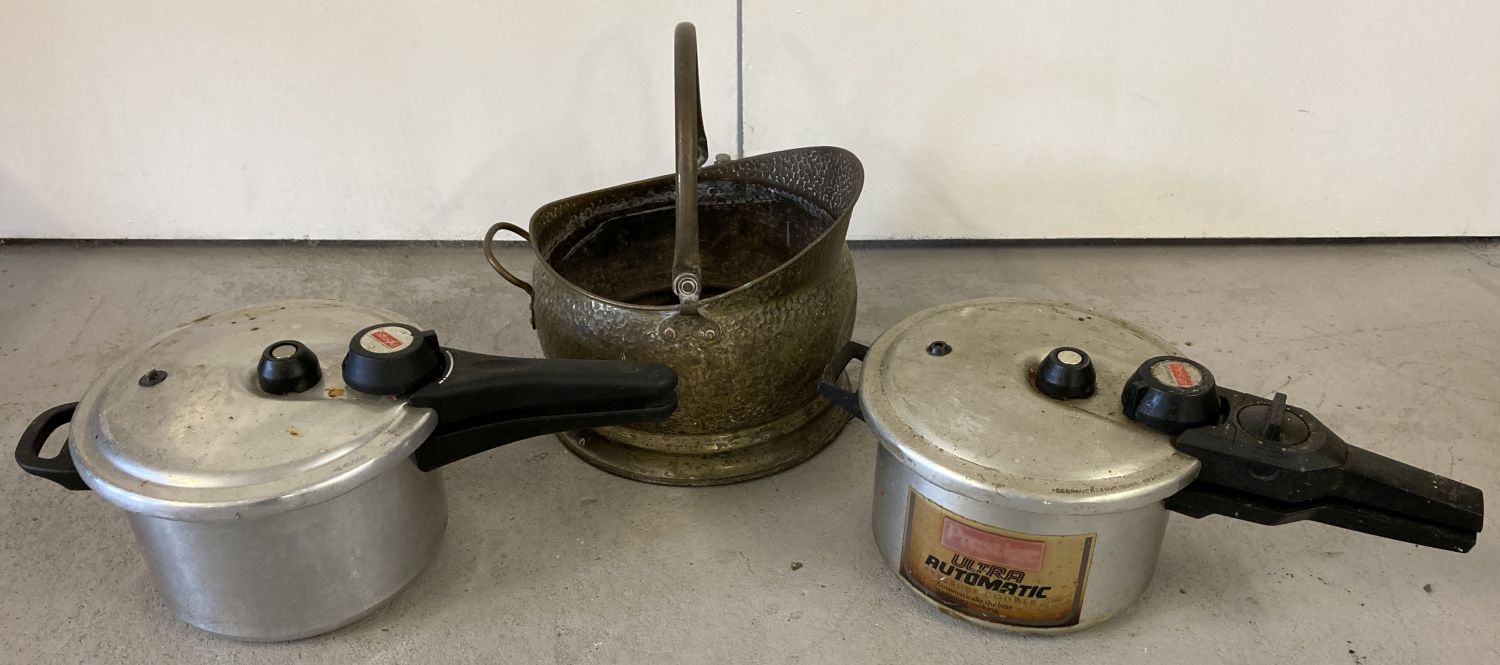 A vintage brass coal bucket together with 2 vintage Prestige pressure cookers.