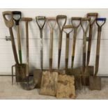 A collection of vintage garden shovels, spades, a fork and lawn edger, mostly wooden handled.