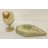 A vintage pale green onyx ashtray together with an onyx stemmed goblet.