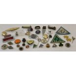 A collection of vintage pins badges, cloth badges and other small misc items.