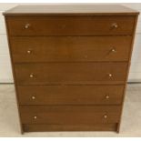 A vintage solid wood medium oak 5 drawer chest of drawers by Austinsuite.