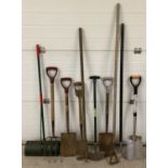 A collection of vintage and modern garden tools to include spades, hoe's, fork and lawn edger.