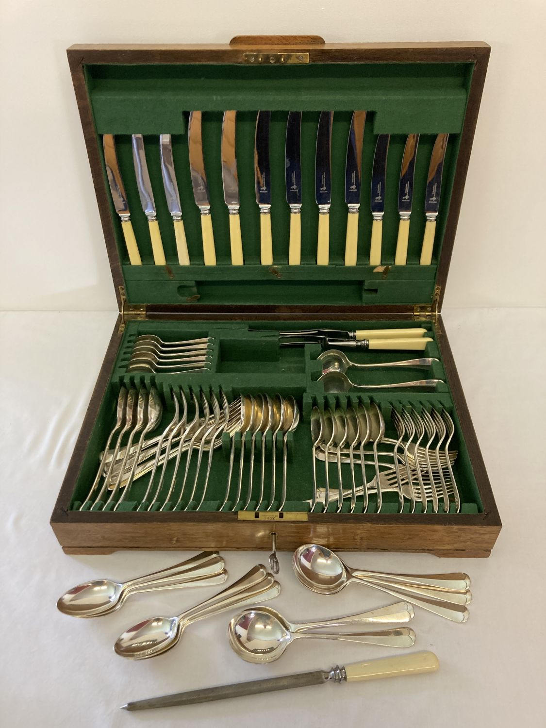 A vintage wooden cased canteen of cutlery by Atkin Brothers, Sheffield. Total of 75 pieces.