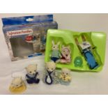 A boxed Sylvanian Families Skidoo playset #4372 together with an unboxed Polar bear family.