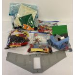 A collection of assorted Lego pieces and play sets.