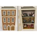 A vintage wooden 3 storey Town House dolls house with contents.