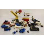 A collection of vintage Lego vehicles and part vehicles.
