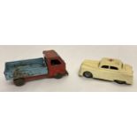 2 vintage toy vehicles. A vintage plastic bodied, friction powered toy ambulance.