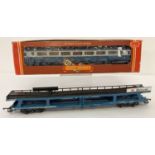 A Hornby BR Inner City coach R439 together with a Lima Motorail transporter (unboxed).