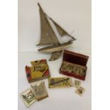 A small collection of assorted vintage toys to include and wooden pond yacht.