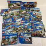 A quantity of assorted Lego City instruction manuals.