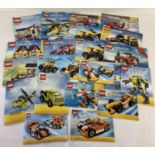 A quantity of assorted Lego Creator instruction manuals.