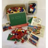 A quantity of vintage 1970's Lego pieces and booklets to include parts from #312 Tanker.