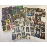 A folder containing a quantity of assorted vintage trading cards.