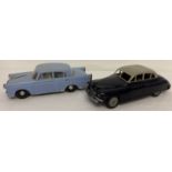 2 x 1960's battery operated plastic body cars. A black & grey sedan style and a blue Morris Oxford.