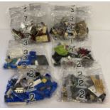6 assorted sealed and unopened Lego set bags.