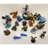 A collection of Skylander interactive figures together with a portal stand and a Strategy guide.