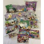 A collection of Lego Friends sets, pieces and booklets.