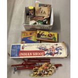 A Mettoy Playthings Indian Shoot game (gun missing) together with a box of vintage games.