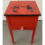 A red painted sewing box with Mickey & Minnie Mouse detail to top.